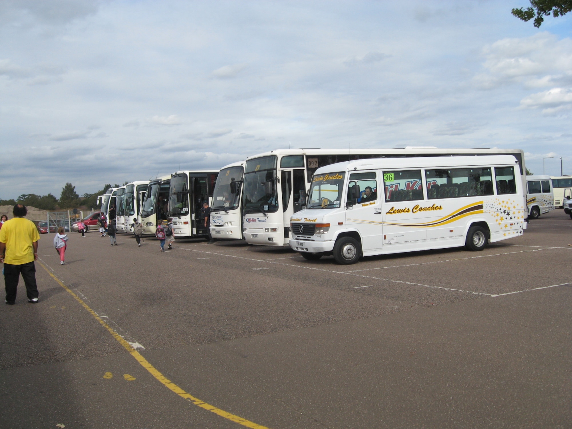 The school buses in the U.K. are not the same yellow and black ones we are used to. They look like commercial coaches with one difference; they have an international school bus sign displayed on the front and rear of the bus.  (U.S. Air Force photo/Tech. Sgt. Chris Campbell)