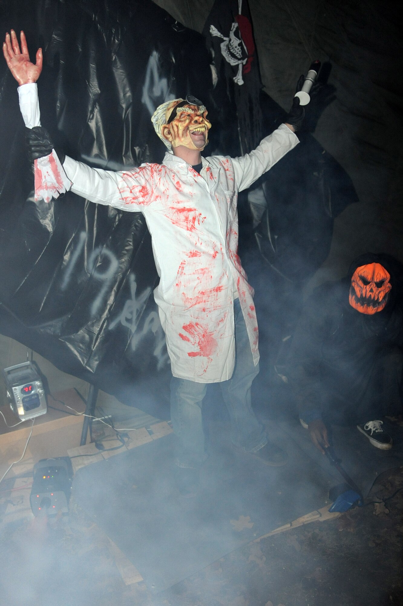 Airman 1st Class Andrew Morrissey, 19th Equipment Maintenance Squadron crew chief, frightens patrons attending the Haunted Trail put on by the 19th Maintenance Group at the small base lake Oct. 28. (U.S. Air Force photo by Senior Airman Ethan Morgan)