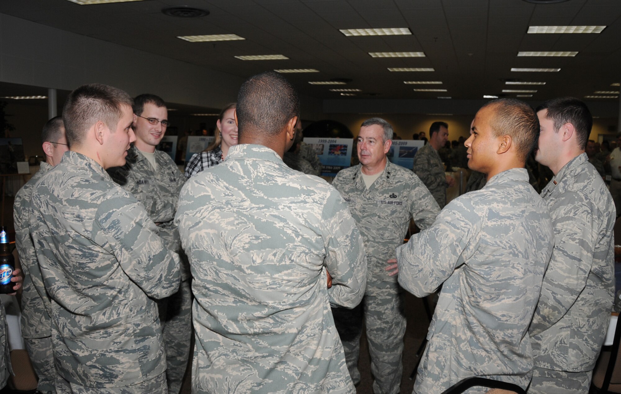 Maj. Gen. Paul Capasso, center, speaks to a group of basic communication officer training students from the 333rd Training Squadron during the Scope Warrior dining-in Oct. 28.  General Capasso, Keesler’s commander from November 2005 to October 2007, now serves as director, infrastructure delivery, office of warfighting integration and chief information officer for the Secretary of the Air Force at the Pentagon.  (U.S. Air Force photo by Kemberly Groue)