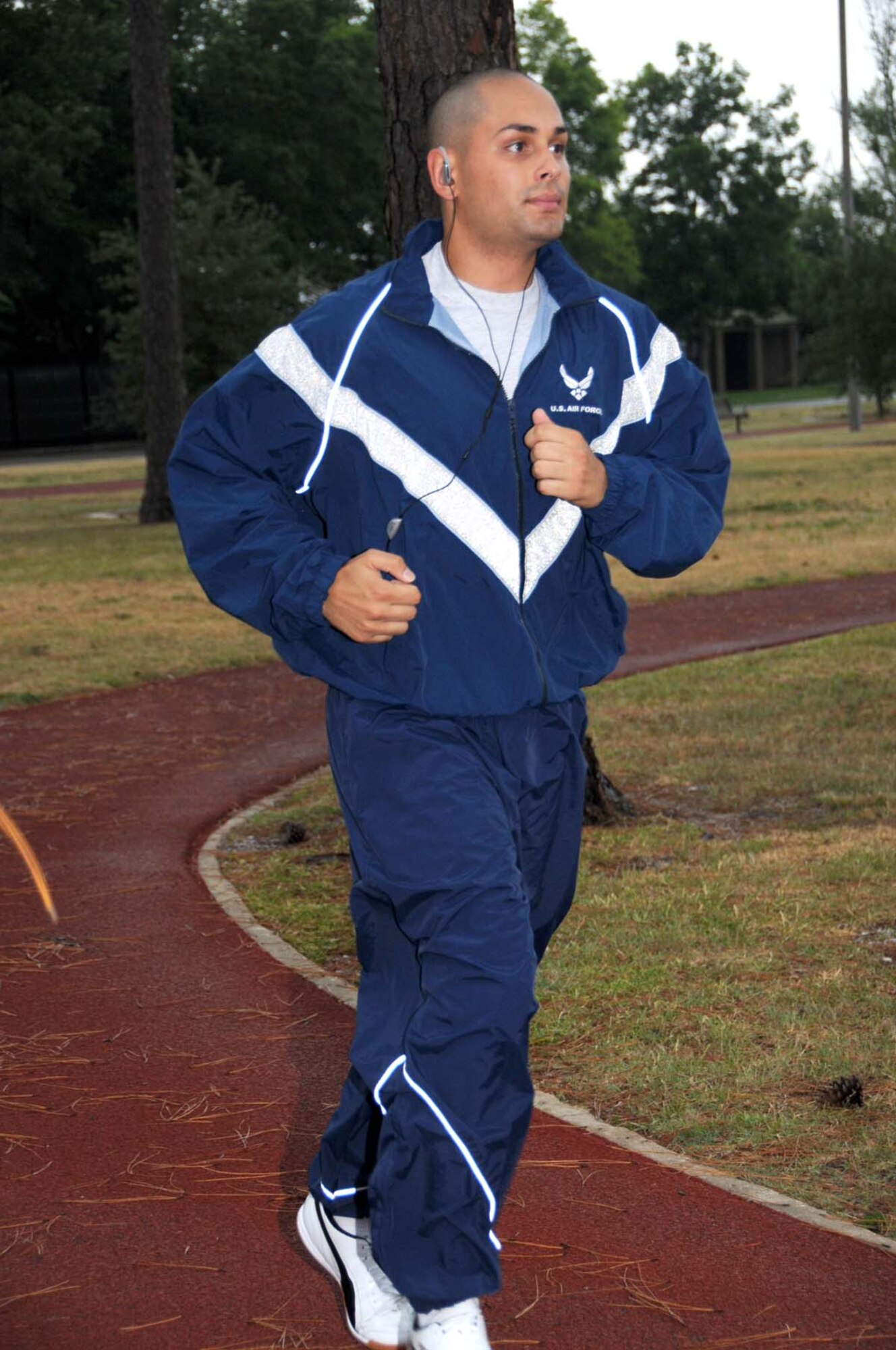 Airman 1st Class Anthony Acevedo, 81st Force Support Squadron, runs at the Crotwell Track.  He and other Keesler Airmen are preparing for new fitness criteria that go into effect in January.  (U.S. Air Force photo by Kemberly Groue)