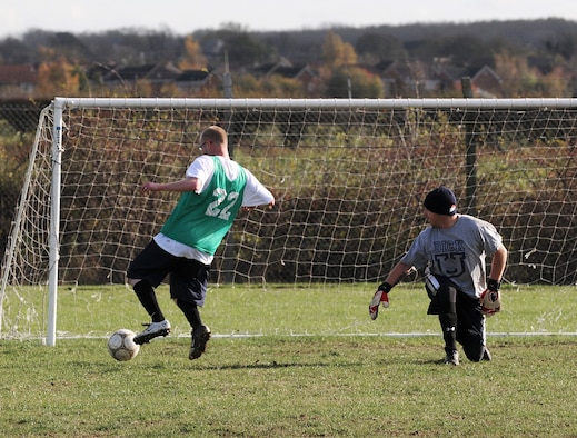 RAF MILDENHALL, England -- Mark Henry, coach for the 100th Security Forces Squadron, scores the winner against the 352nd Maintenance Squadron in intramural soccer at the Hardstand Fitness Center Nov. 4. Two other goals by Angel Santos helped the 100th SFS to a 3-2 victory. (U.S. Air Force photo/Senior Airman Thomas Trower)