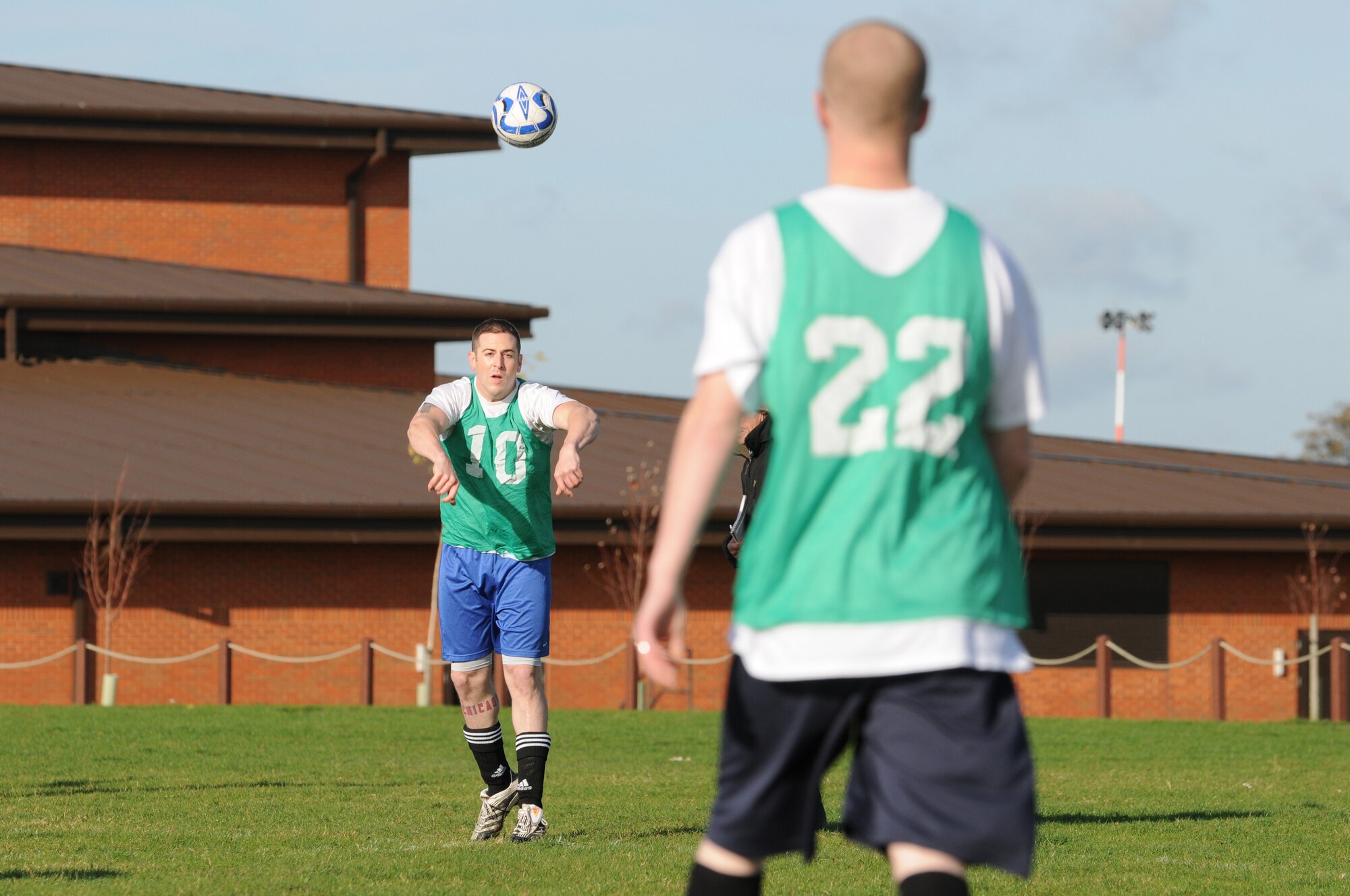 RAF MILDENHALL, England -- Daniel Baker (10), 100th Security Forces Squadron, throws the ball to Mark Henry during an intramural soccer match at the Hardstand Fitness Center Nov. 4. The 100th SFS' late goal from Henry against the 352nd Maintenance Squadron won the game 3-2. (U.S. Air Force photo/Senior Airman Thomas Trower)