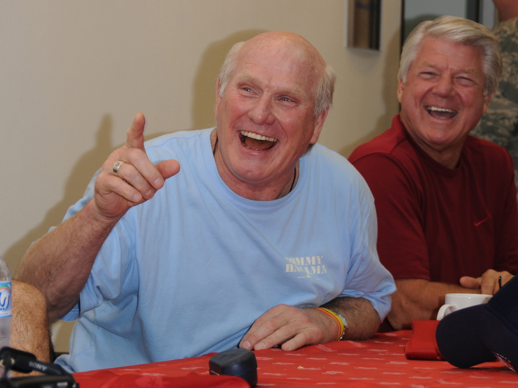 Terry Bradshaw and Jimmy Johnson, NFL on FOX analysts, answer questions from deployed Airmen during an informal breakfast at an undisclosed location in Southwest Asia, Nov. 5, 2009. The NFL on FOX team is  touring the U.S. Central Command's area of responsibility as part of an Armed Forces Entertainment sponsored tour. (U.S. Air Force Photo/Tech. Sgt. Jason W. Edwards)