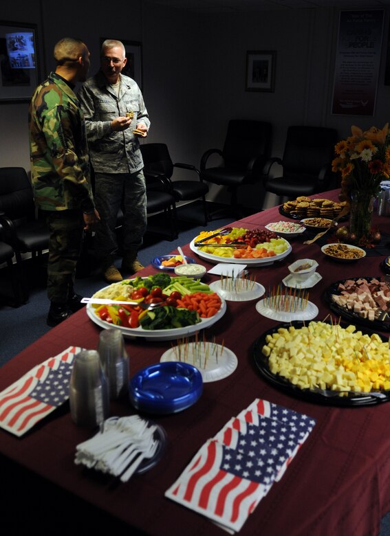 U.S. Air Force Senior Master Sgts. Manny Pineiro, 86th Logistics Readiness Squadron first sergeant, and Joel Tilley, 86th Mission Support Squadron first sergeant, snack on foods that were provided by the Airman and Family Readiness Center during the open house for the Air Force Family Week, Ramstein Air Base, Germany, Nov. 4, 2009. Nov 1st thru the 7th is designated by Secretary of the Air Force as "Air Force Family Week". (U.S. Air Force photo by Airman 1st Class Caleb Pierce)