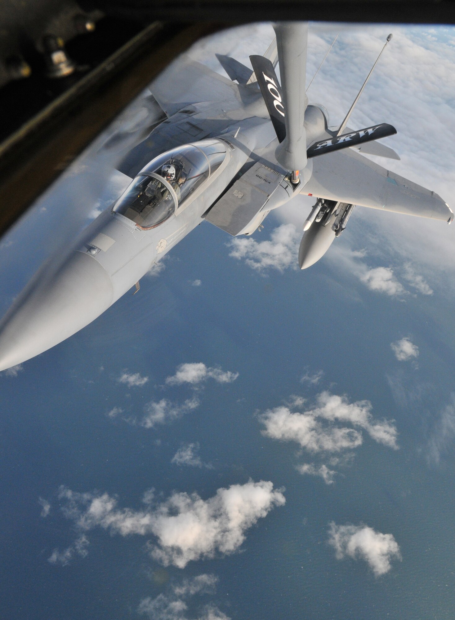 A 48th Fighter Wing F-15E Strike Eagle from RAF Lakenheath, England receives fuel from an RAF Mildenhall KC-135 Stratotanker Nov. 4. A local school teacher and museum employee witnessed the event during their Community Orientation Flight.  (U.S. Air Force photo/Tech. Sgt. Kevin Wallace)