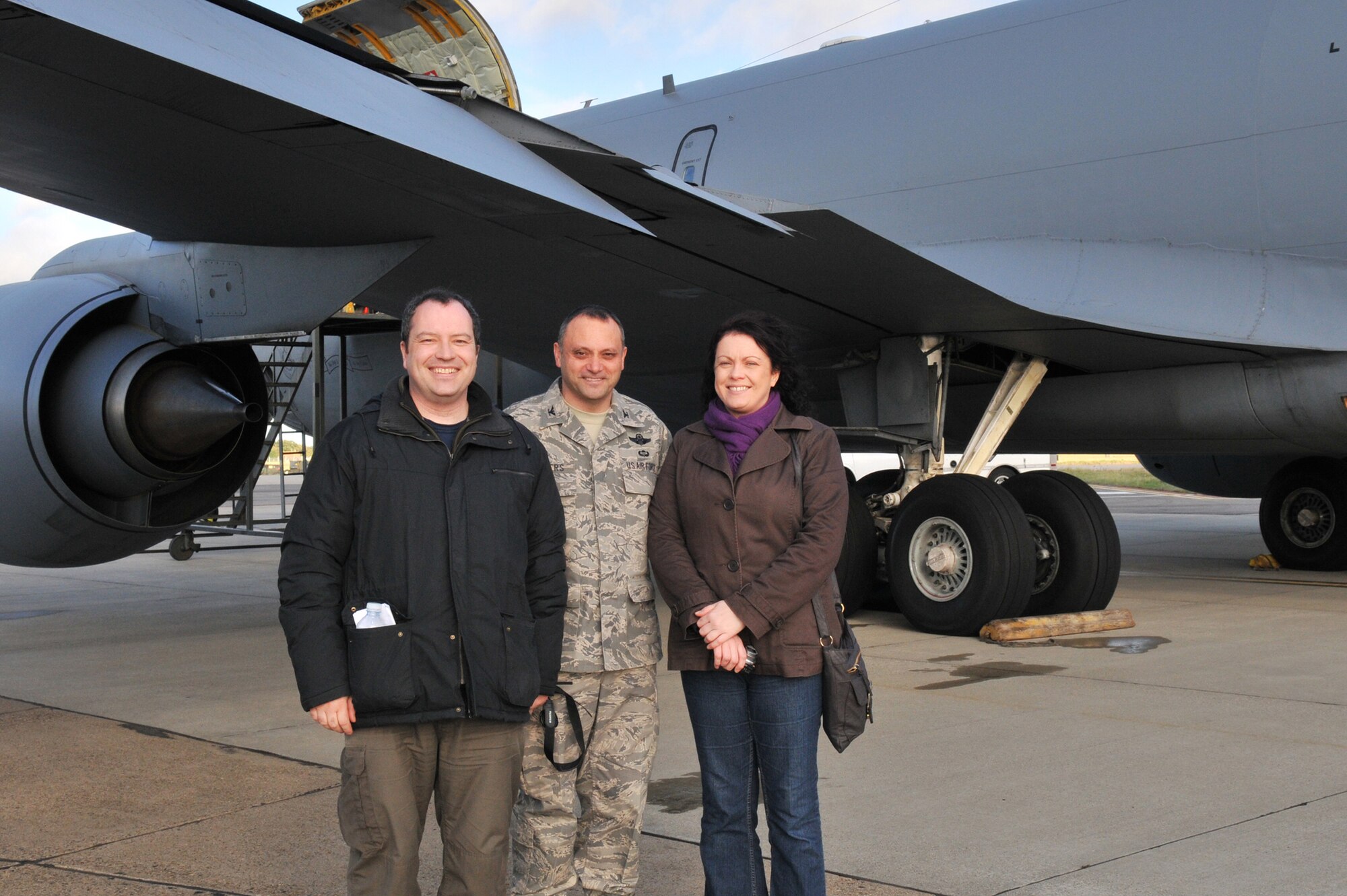 Stephen Bond, Imperial War Museum, Duxford, employee, Col. Mike Winters, 100th Air Refueling Wing vice commander, and Ruth Cresswell, Great Heath Primary School teacher, gather outside a KC-135 Stratotanker before a Community Orientation Flight Nov. 4. Orientation flights are designed to familiarize key groups or members of the community with educational information about the missions of the 100th ARW and the U.S. Air Force. (U.S. Air Force photo/Tech. Sgt. Kevin Wallace)