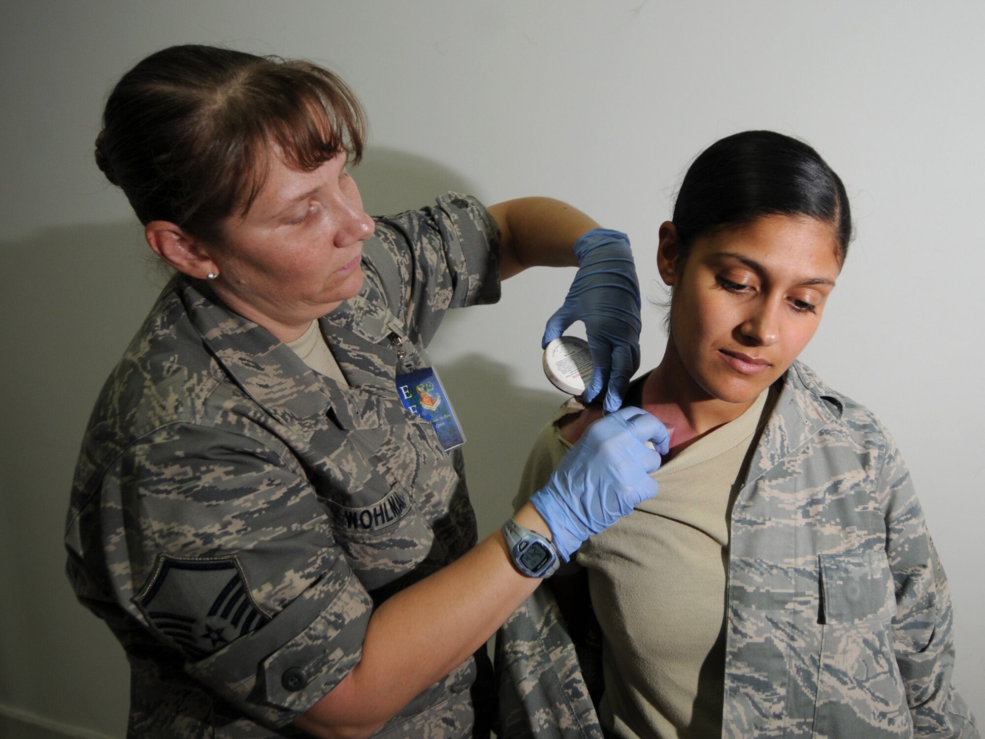 Master Sgt. Chyrle Wohlman, 379th Expeditionary Medical Group primary care and emergency services NCOIC, applies make-up to a simulated casualty prior to a basewide exercise at an undisclosed location in Southwest Asia, Nov. 3, 2009. Personnel assigned to the 379th Air Expeditionary Wing and other tenant units participate in exercises regularly to train on a variety of potential real-world scenarios. Sergeant Wohlman is deployed from McGuire Air Force Base, N.J. in support of operations Iraqi Freedom and Enduring Freedom. (U.S. Air Force Photo/Tech. Sgt. Jason W. Edwards)