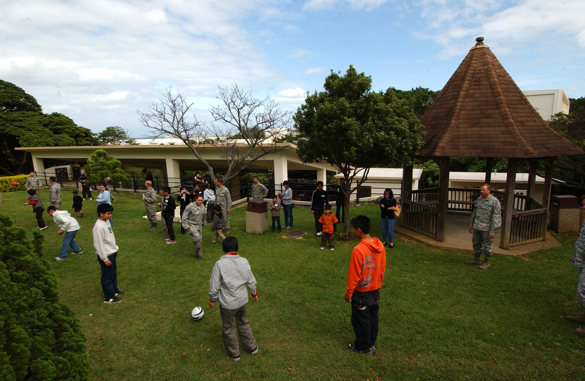 Airmen assigned to Detachment 3, spent the day playing games with special needs students from the Asahi Ryo special needs school located in Haebaru, near Naha City. The barbecue was hosted by the Detachment 3, USAF School of Aerospace Medicine, at Rodriguez Park Nov. 3, Kadena Air Base, Japan. This was the first time the students experienced an American barbecue as they spent the entire “Culture Day” interacting with military members while enjoying food and fun.  (U.S. Air Force photo/Tech. Sgt. Rey Ramon) 