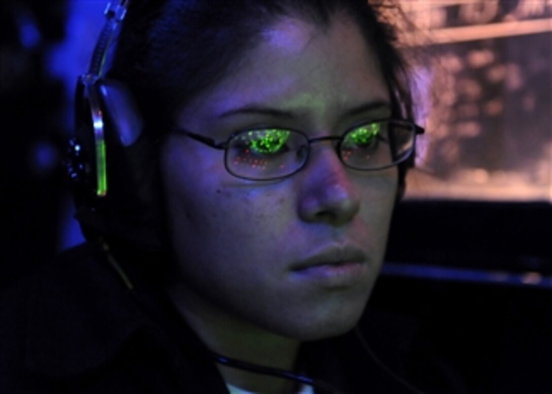 U.S. Navy Seaman Christina Banegas monitors the SPS-48 radar in the Combat Information Center aboard the U.S. 7th Fleet command ship USS Blue Ridge (LCC 19) on Nov. 3, 2009.  The Blue Ridge is on deployment serving under Commander, Expeditionary Strike Group 7/Task Force 76, the Navy's only forward-deployed amphibious force.  