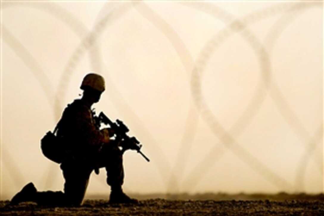 U.S. Navy Petty Officer 3rd Class Nicolas Grey pauses during a patrol in the Nawa district, Helmand province, Afghanistan, Oct. 28, 2009. The 1st Battalion, 5th Marine Regiment is one of the ground combat elements deployed with Regimental Combat Team 7. Grey is assigned to the Combined Anti-Armor Team 2.