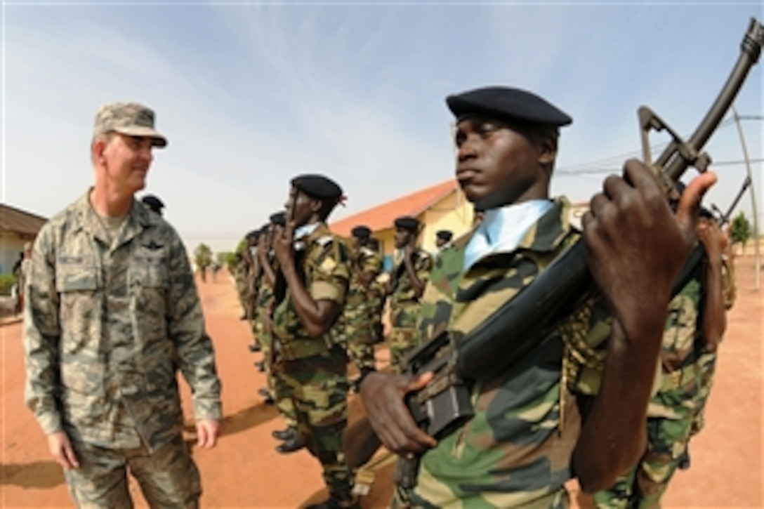 Members of the 3d Infantry Battalion Honor Platoon greet Brig. Gen. Mike Callan in Kaolack, Senegal, Oct. 30, 2009. Callen was invited to speak at the graduation ceremony for the first class of NCO Academy instructors.