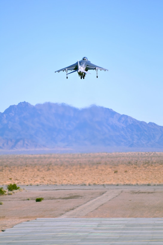 Capt. Gary Shill, AV-8B Harrier test pilot with Air Test and Evaluation Squadron 31, takes off from Auxiliary Airfield 2 in Yuma, Ariz., Nov. 5, 2009. The squadron and the USS Green Bay flight deck crew practiced working together at the airfield, which simulates the deck of a ship, to prepare for their upcoming testing period aboard the Green Bay. The Green Bay, commissioned January 2009, is part of the Navy’s new class of amphibious transport dock ship built specifically for helicopter operations. The squadron tested Harrier operations aboard the ship Nov. 11-15, 2009 to ensure that its design doesn’t inhibit use by Harriers in case of emergencies. Since the Green Bay is intended for helicopter use, many of its flight crew are inexperienced working with Harriers.  “A lot of our crew members are very new to the fleet and many have never worked with jets before,” said Petty Officer 1st Class Albaro Rodriguez, USS Green Bay aviation fuel technician. “This is giving them a good chance to get prepared for possible emergency situations.”