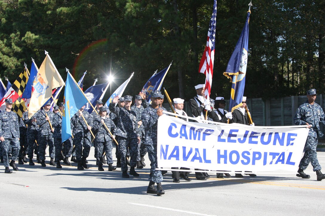 Sailors from Camp Lejeune's Naval Hospital march in the Veterans Day Parade on Western Boulevard in Jacksonville on Nov. 7. The sailors carried the 50 state flags in their formation.