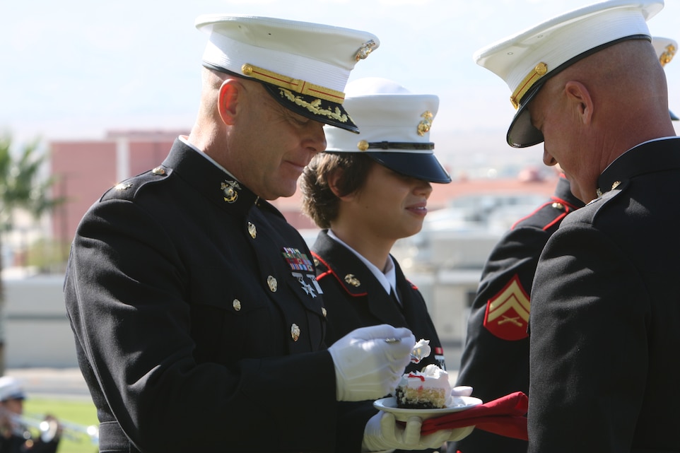 MARINE CORPS AIR GROUND COMBAT CENTER TWENTYNINE PALMS, Calif. -Maj. Jay Rogers, 56, the food service officer with Headquarters Battalion, prepares to taste the birthday cake at the Combat Center's 234th Marine Corps Birthday Pageant at Lance Cpl. Torrey L. Grey Field Nov. 6. Rogers was the oldest Marine present and the youngest Marine was Pfc. Amber Martin, 18, a student at the Marine Corps Communications-Electronics School.