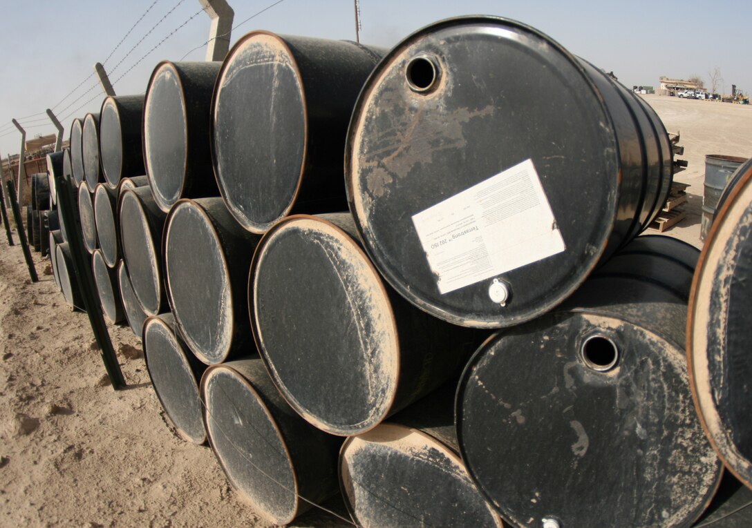 Fifty five-gallon drums are organized and stacked at a Hazardous Material Lot aboard Camp Al Taqaddum, Iraq, Nov. 6, 2009.  The drums will be used to transport hazardous material to a proper disposal site. (U.S. Marine Corps photograph by Cpl. M. M. Bravo)