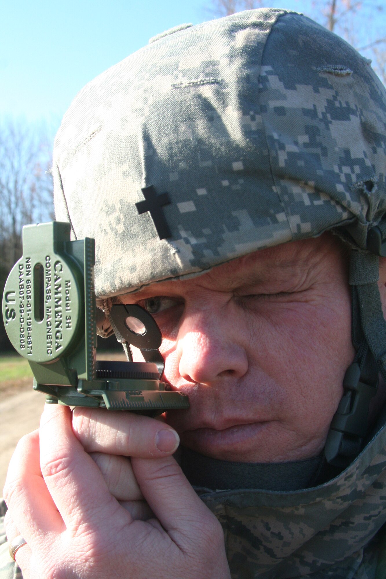 Chaplain (Capt.) Steve Fisher, from the 3rd Wing at Elmendorf Air Force Base, Alaska, and a student in the Combat Airman Skills Training Course 10-1A, taught by the U.S. Air Force Expeditionary Center's 421st Combat Training Squadron, uses a compass during a day of land navigation training in the course on a range at Joint Base McGuire-Dix-Lakehurst, N.J., on Nov. 6, 2009.  The course prepares Airmen for upcoming deployments.  (U.S. Air Force Photo/Tech. Sgt. Scott T. Sturkol)
