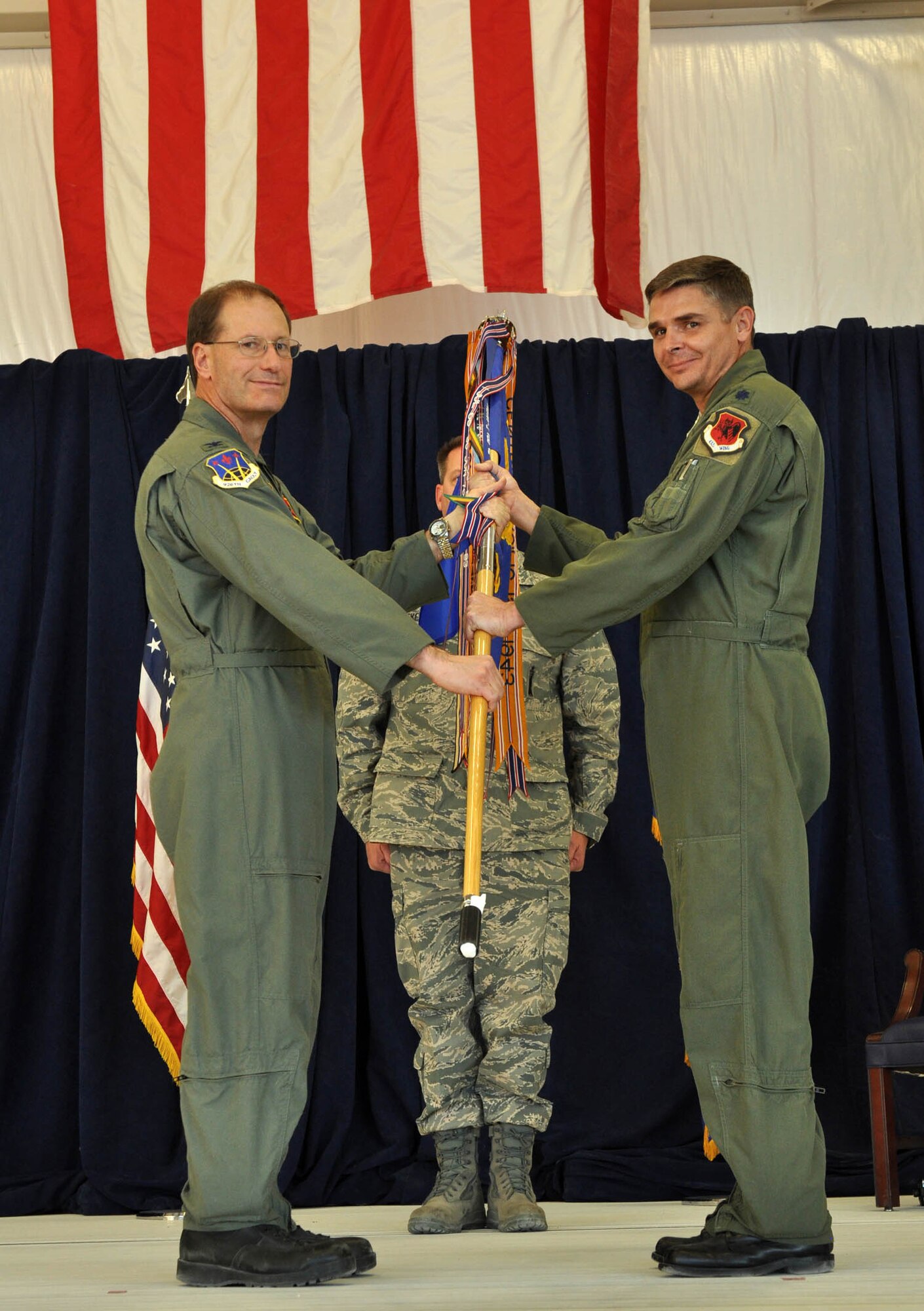Lt. Col. Myers (right), receives the guideon from Col. Brunke, 926th Group commander, as he assumes command of the 78th Reconnaissance Squadron during a change of command ceremony Nov 2. (U.S. Air Force photo/Airman First Class Stephanie Rubi)