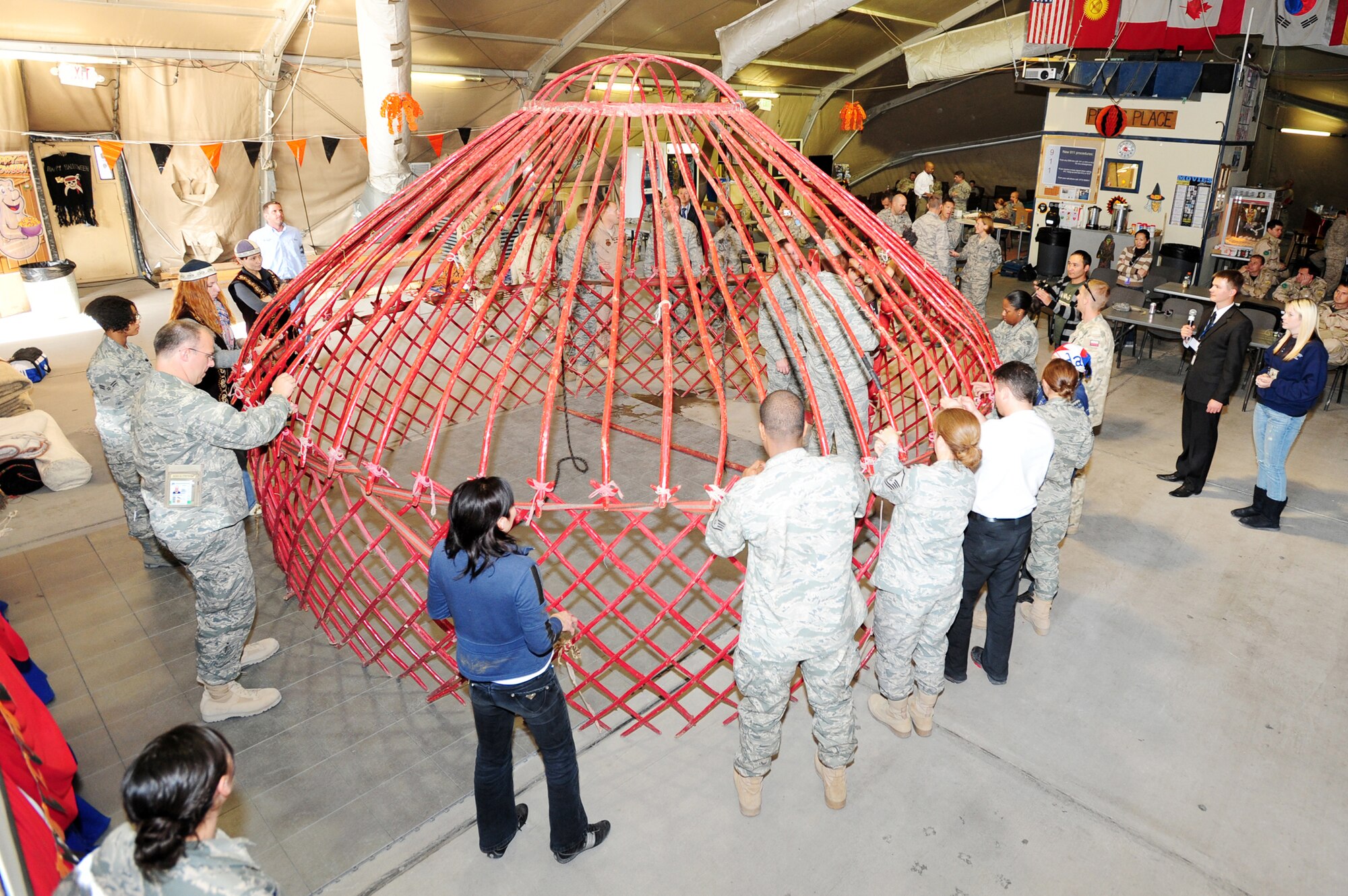 A traditional Kyrgyz yurt is constructed by those stationed at the at the Transit Center at Manas, Kyrgyzstan, as part of Kyrgyz Culture Day recently. The yurt is made from wood, leather, and materials for walls and roofing. (U.S. Air Force photo/Senior Airman Steele Britton)