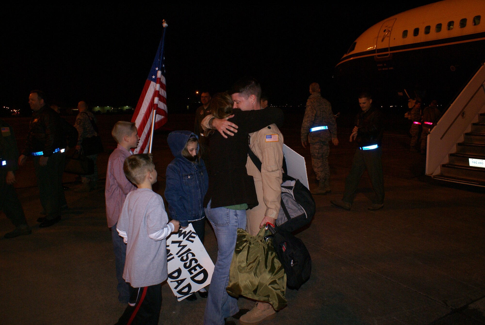 An Airman greets his family Wednesday after returning from a 120-day deployment to Southwest Asia. (U.S. Air Force photo/Tech. Sgt. Oshawn Jefferson)