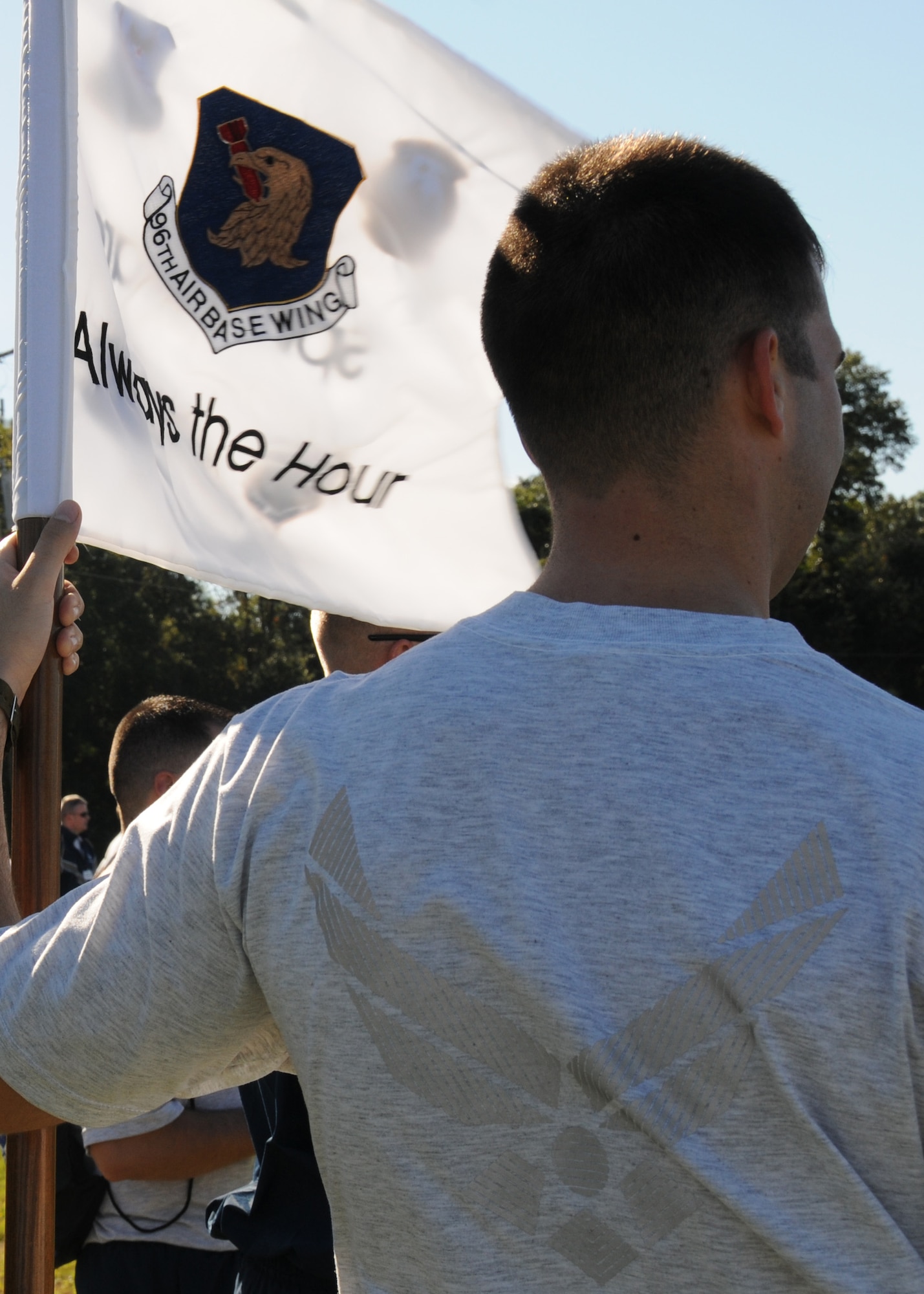 An Airman carries the 96th Air Base Wing spirit flag during Eglin’s Wingman Day Nov. 5.  Wingman Day was held to enhance personal wellness, increase unit cohesion and the installation community’s ability to care for itself, for one another and to accomplish the mission through activities that promote high-level team functioning and decrease “risk factor” behaviors. 