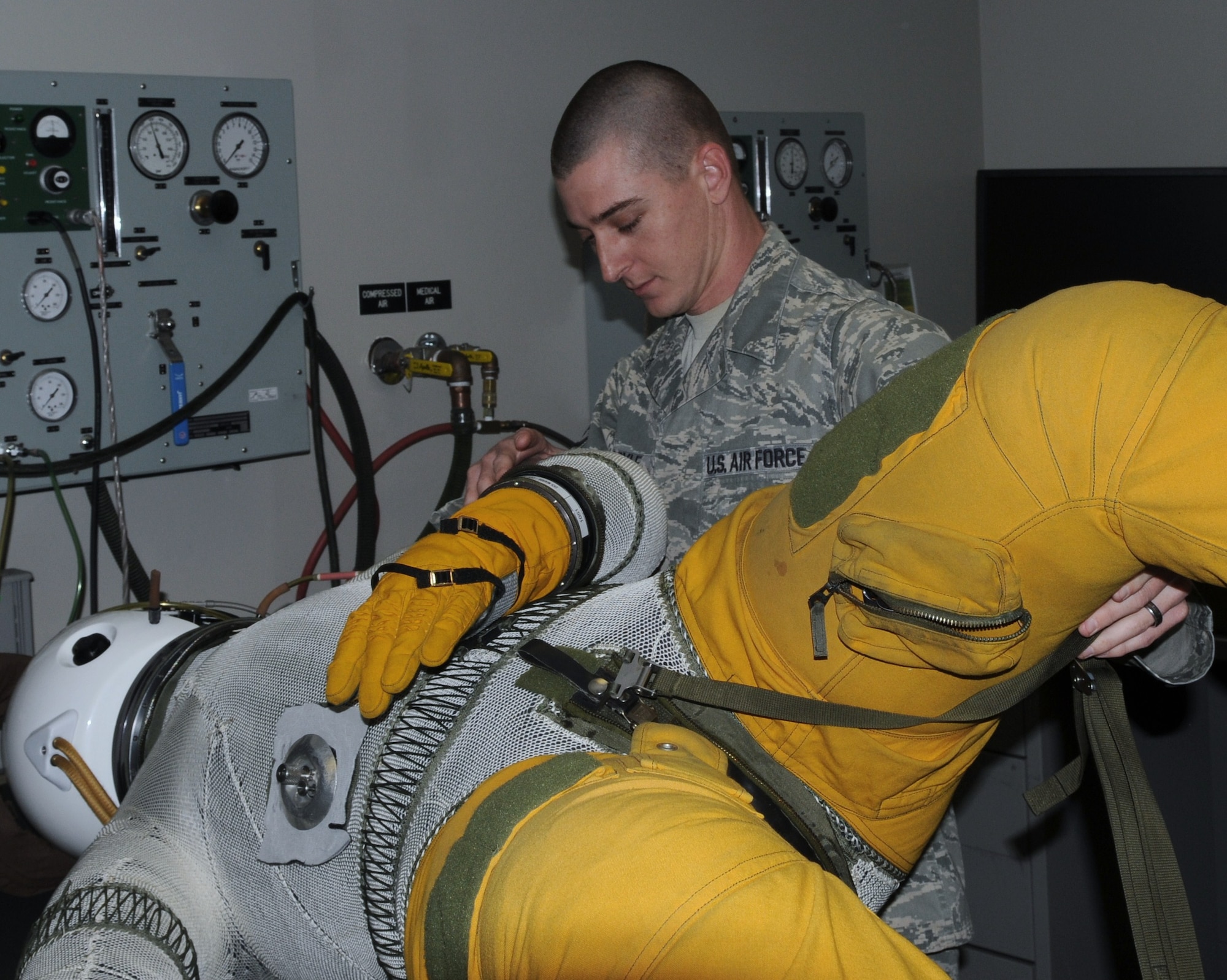 Staff Sgt. John Doyle, assistant non-commissioned Officer in charge of Suit Maintenance at the 9th Physiological Support Squadron, rechecks a U-2 flight suit for any leaks before being certified for use. Sergeant Doyle’s re-inspection ensures the suit does not lose its shape or depressurizes during high altitude flights.(U.S Air Force photo by Senior Airman Kevin Iinuma) 