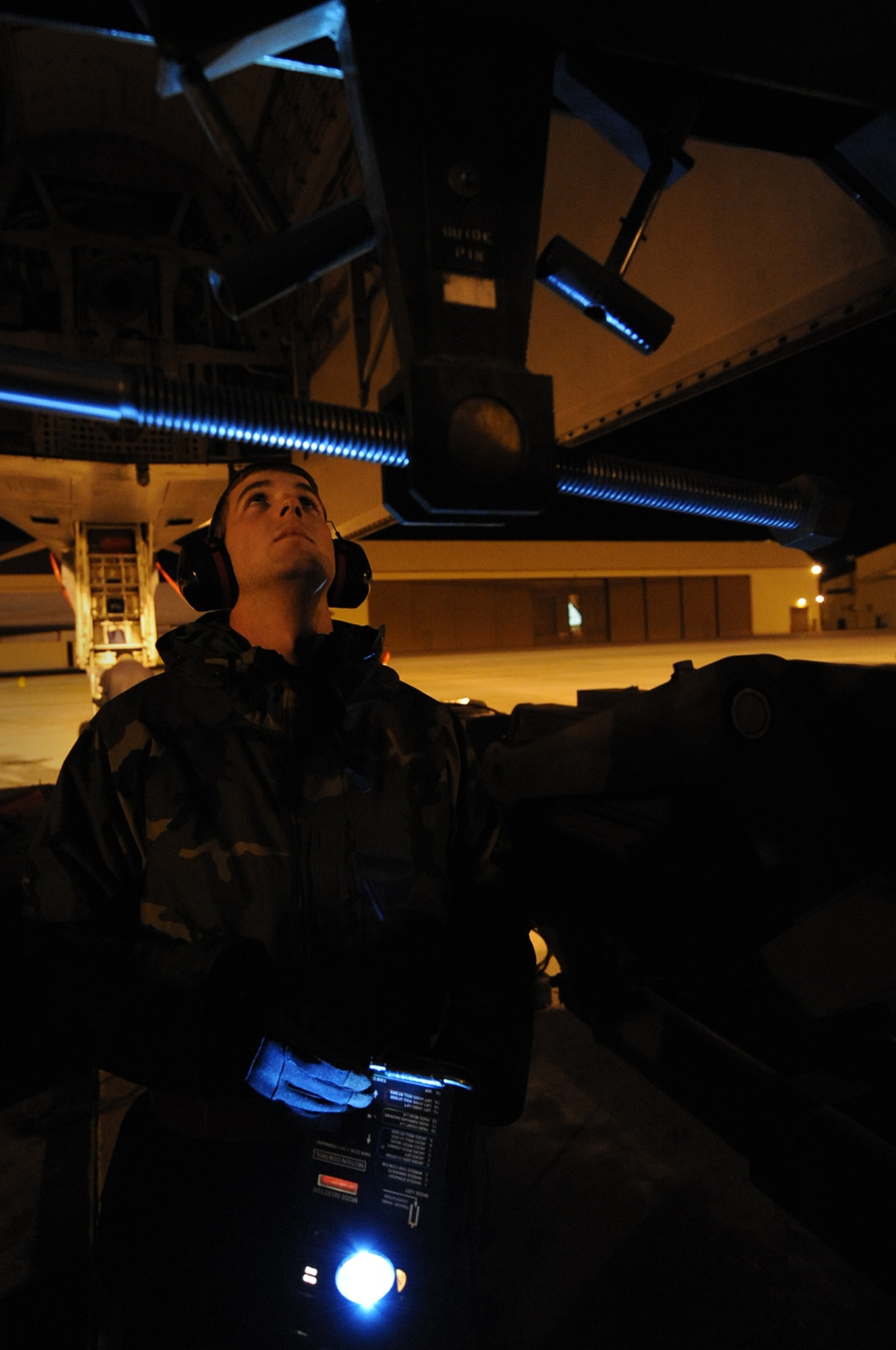 ELLSWORTH AIR FORCE BASE, S.D. -- Staff Sgt. Joseph Veltri, 28th Maintenance Squadron weapons load crew member, inspects a B-1B Lancer bomb bay, Nov. 4. Weapons load crew members load bombs and inspect bomb bays to ensure mission readiness. (U.S. Air Force photo/Airman 1st Class Joshua J. Seybert)