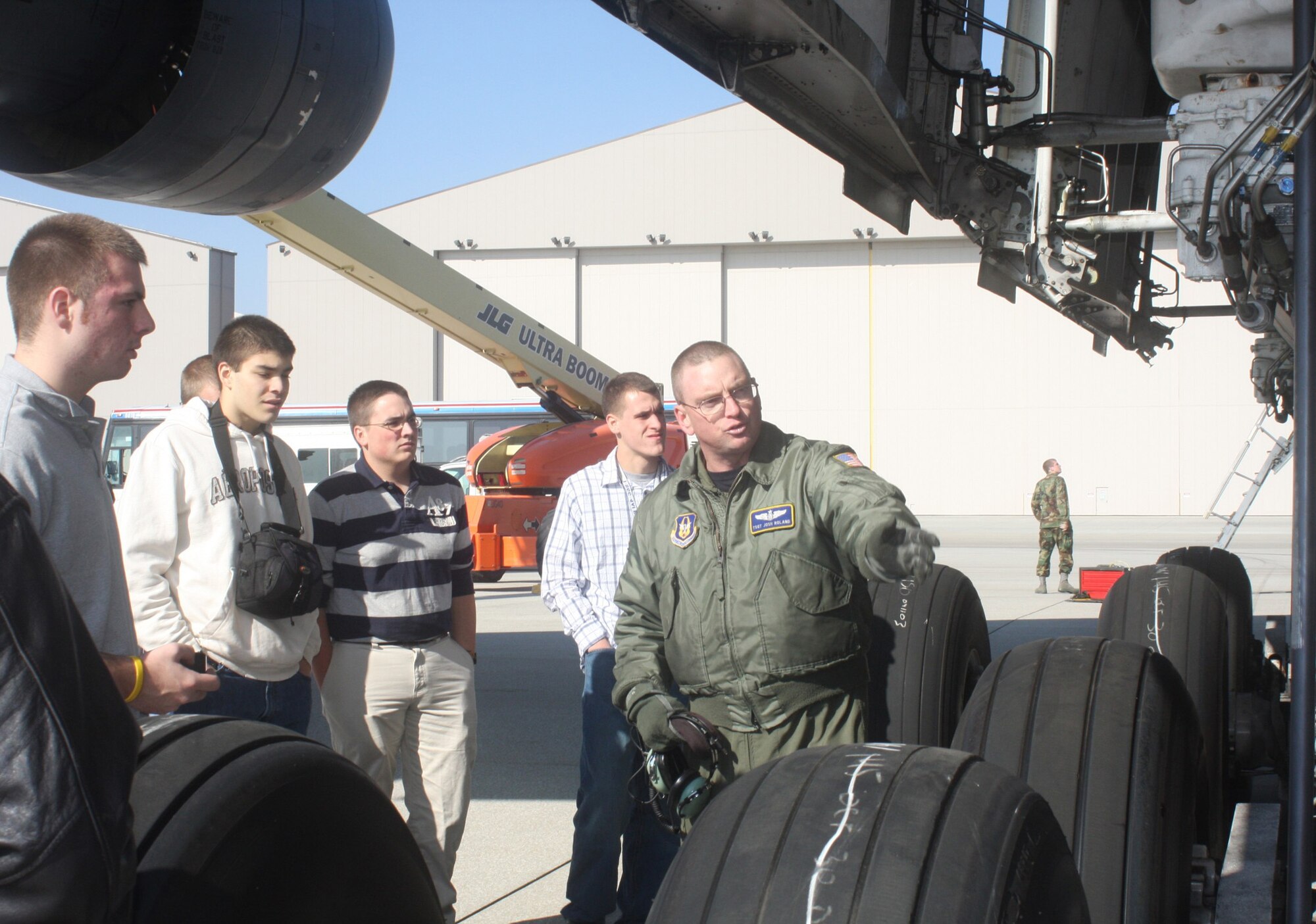 WRIGHT-PATTERSON AIR FORCE BASE, Ohio - Tech. Sgt. Josh Roland, 89th Airlift Squadron, discusses the mechanics of the wheels of a C-5 Galaxy to 24 ROTC cadets from Cornell University, Syracuse University and Rochester Institute of Technology, as they toured the aircraft. (U. S. Air Force photo/Stacy Vaughn)