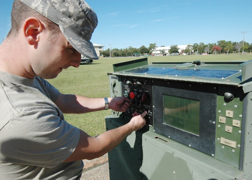 Tech. Sgt. Joseph McDermid, 919th Communications Squadron, dials in the computer-run generator to be used for the UTA weekend's "Family Day" at Duke Field.  It was just one of three generators the squadron would hook up Nov. 6.  (Air Force photo/Staff Sgt. Samuel King Jr.)