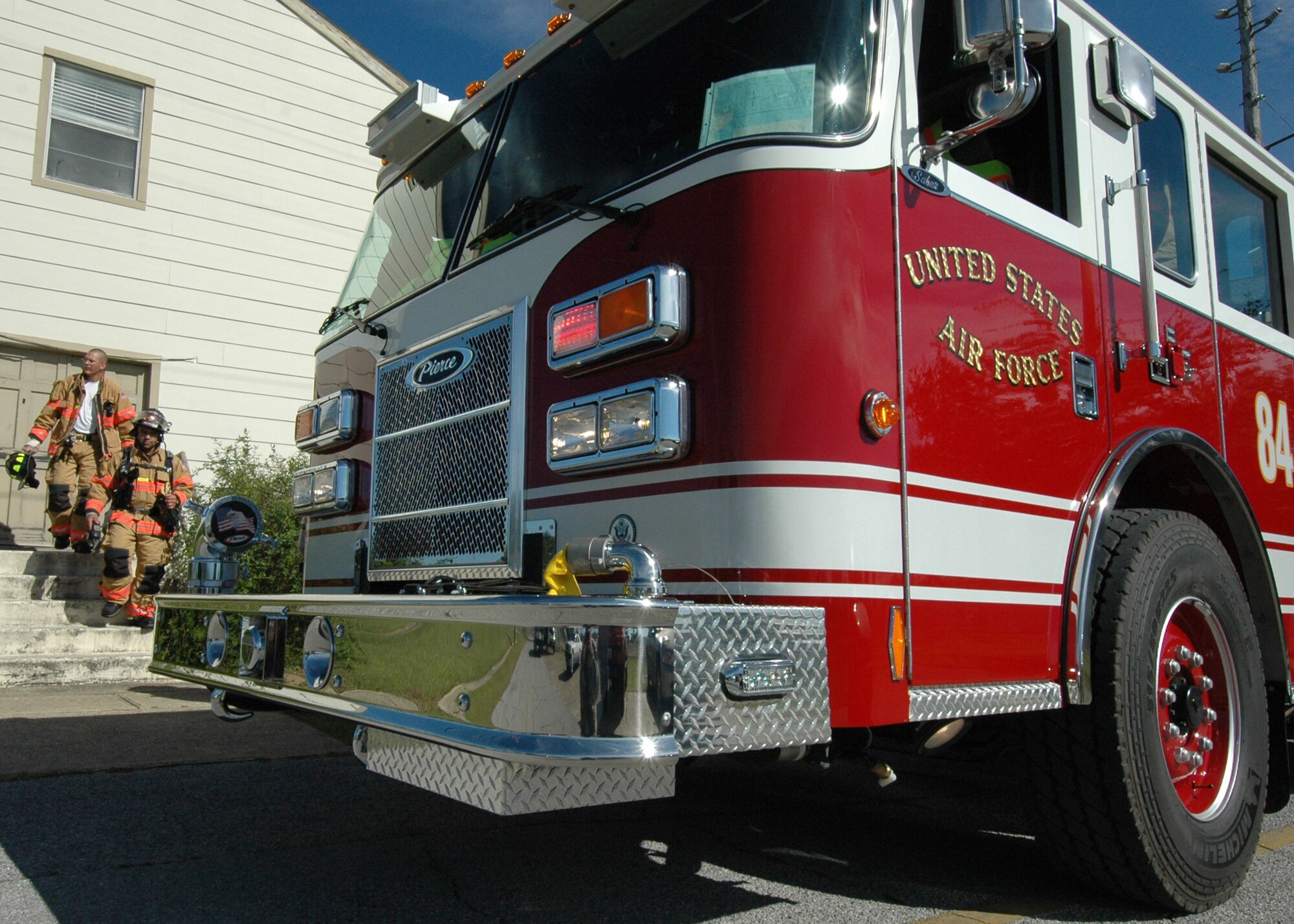 96th Civil Engineer Squadron firefighters exit a Duke Field building after responding to an emergency call Nov. 6.  The firefighters entered the building and cleared it to ensure it was safe.  (Air Force photo/Staff Sgt. Samuel King Jr.) 