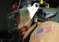 Franz Menay, a firefighter with the 96th Civil Engineer Squadron, relaxes after responding to an emergency call at a Duke Field building Nov. 6.  The firefighters entered the building and cleared it to ensure it was safe.  (Air Force photo/Staff Sgt. Samuel King Jr.) 