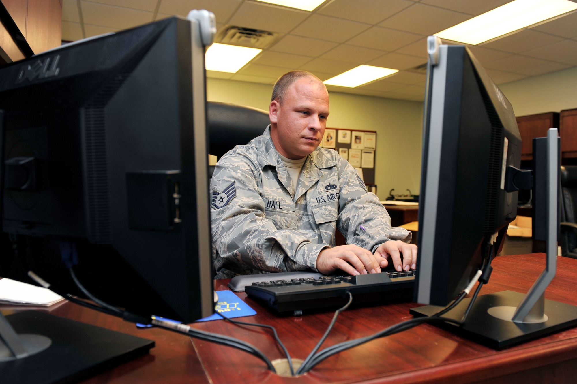 Staff Sgt. Justin Hall, 314th Aircraft Maintenance Squadron unit security manager, reviews and updates training reports Nov. 3. Col. Michael Zick, 19th Airlift Wing vice commander presented Sergeant Hall, the Unit Security Manager of the Year Award for his performance in managing all the duties as a USM efficiently and serving an integral role in the protection of national security. (U.S. Air Force photo by Airman 1st Class Lausanne Pacheco)