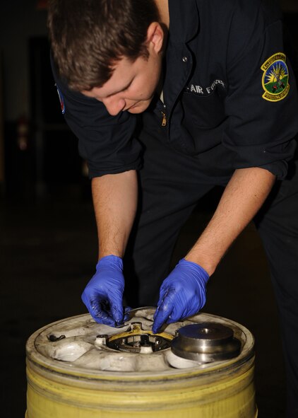 Staff Sgt. Andrew West, 4th Equipment Maintenance Squadron wheel and tire shop non-commissioned officer in charge, installs a main tire bearing can on the main landing gear tire of an F-15E Strike Eagle on Seymour Johnson Air Force Base, N.C., Nov. 5, 2009. This bearing can is an of the essential part of the tire, it makes the tire spin freely once installed onto a jet. (U.S. Air Force photo/Senior Airman Ciara Wymbs)