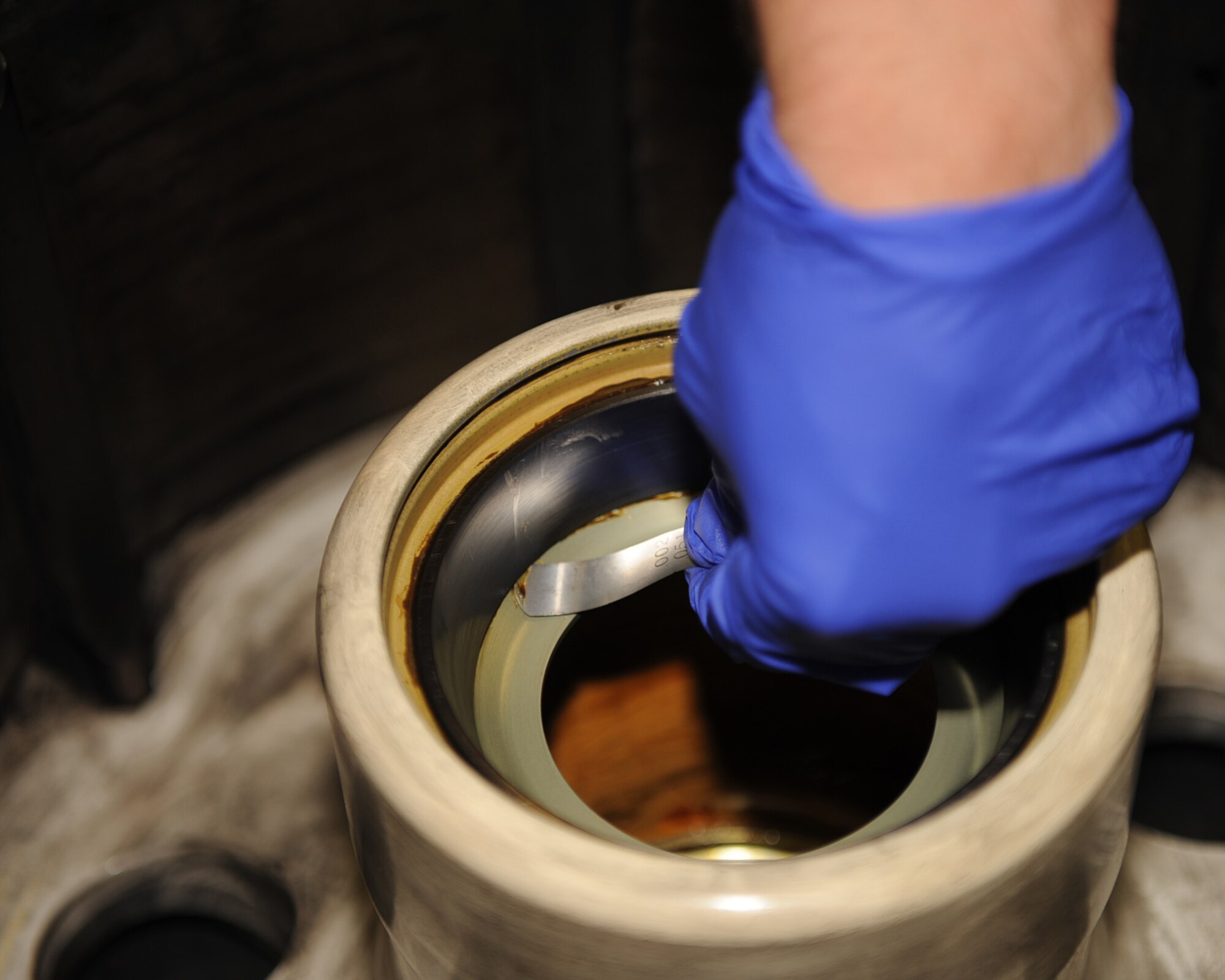 An Airman from the 4th Equipment Maintenance Squadron inspects wheel hubs of an F-15E Strike Eagle's main landing gear tire on Seymour Johnson Air Force Base, N.C., Nov. 5, 2009. An inspection must be done after a tire is broken down to ensure its tolerance is in accordance with technical orders. (U.S. Air Force photo/Senior Airman Ciara Wymbs)