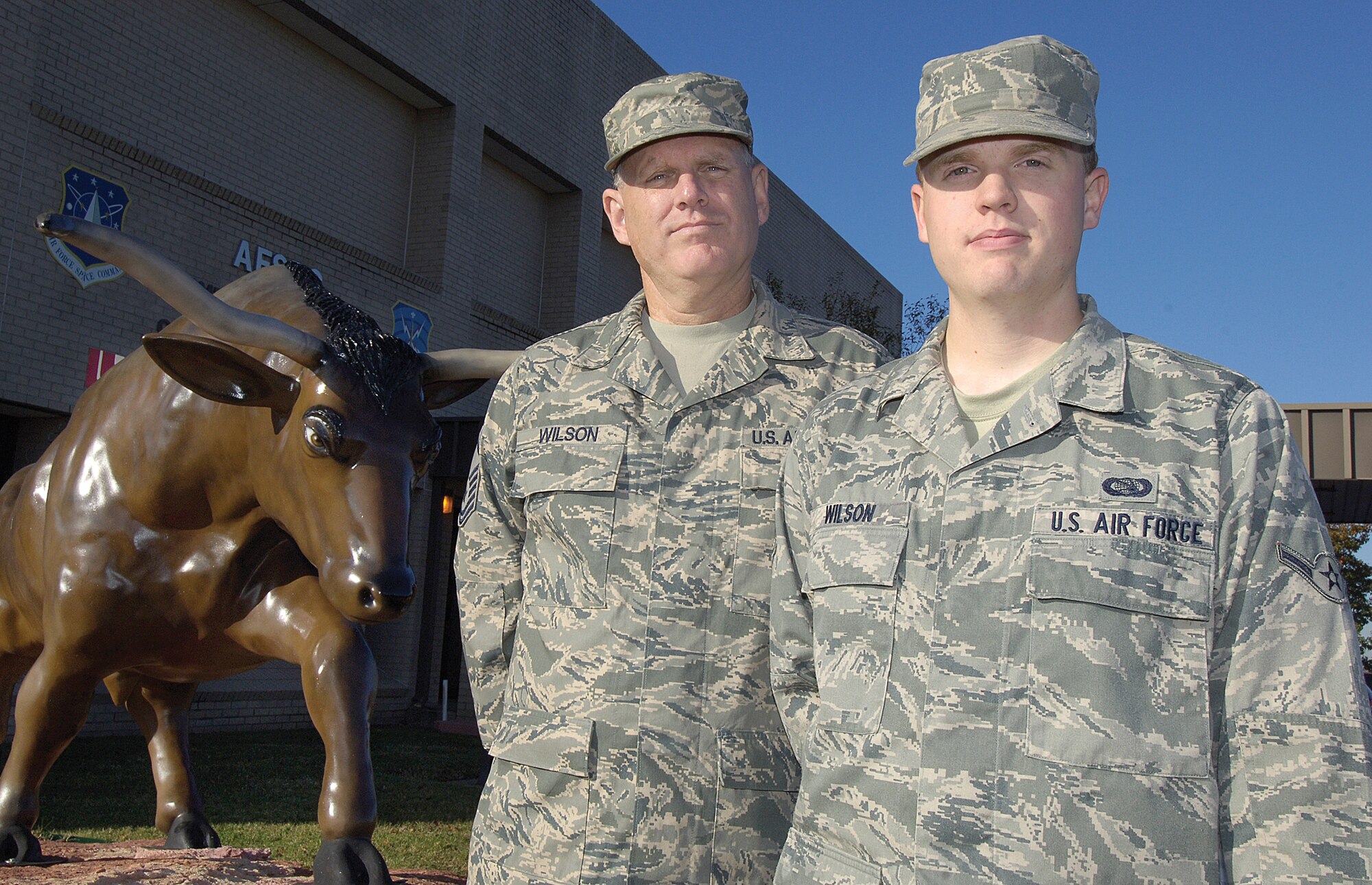 Master Sgt. Dennis Wilson, superintendent of the Base Level Systems Flight in the 31st Combat Communications Squadron is stationed in the same group as his son, Airman James Wilson, who is assigned to the 33rd Combat Communcations Squadron. (Air Force photo by Margo Wright)