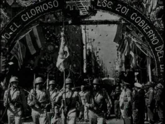 A vintage photograph from the parade in Mexico City shows the proud men of Escuadron 201 marching through the streets as throngs of their countrymen greet them with a hero's welcome.  (Photo Courtesy of Asociacion Mexicana de Veteranos)