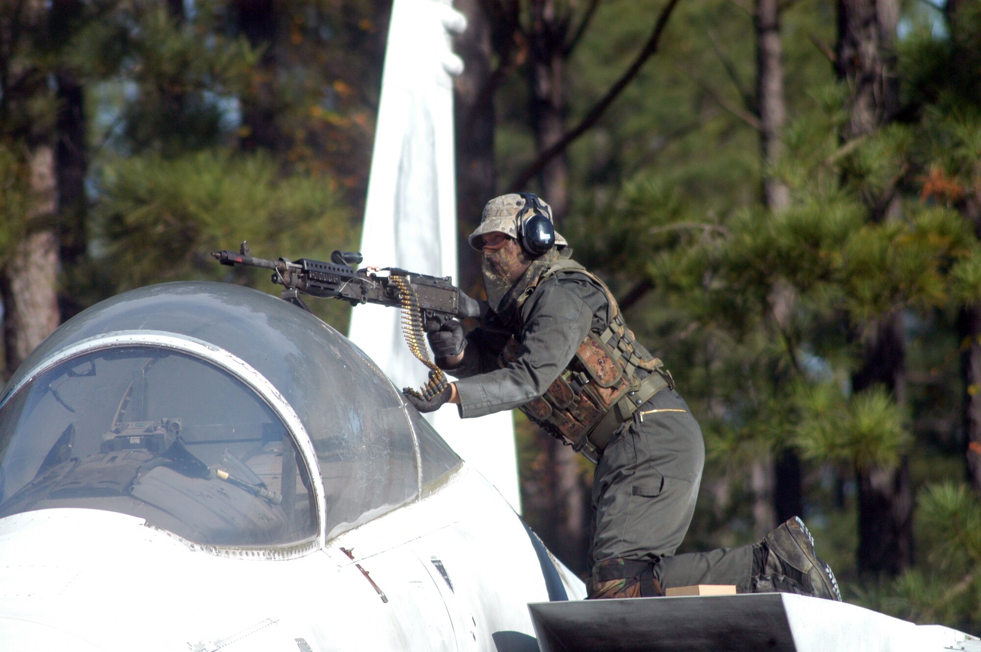 An airman posing as a member of the opposition opens fire on the convoy during training Oct. 29. U. S. Air Force photo by Sue Sapp    