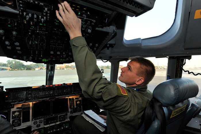 Capt. Scott Graves performs a preflight inspection on the instrument panels of a C-17 prior to a routine training mission here Nov. 4. Charleston AFB's flying squadrons performed more than 270 training missions during the month of October to keep aircrews proficient on flying skills such as take-offs, landings and the use of night vision equipment. Captain Graves is a pilot with the 16th Airlift Squadron. (U.S. Air Force photo/James Bowman)