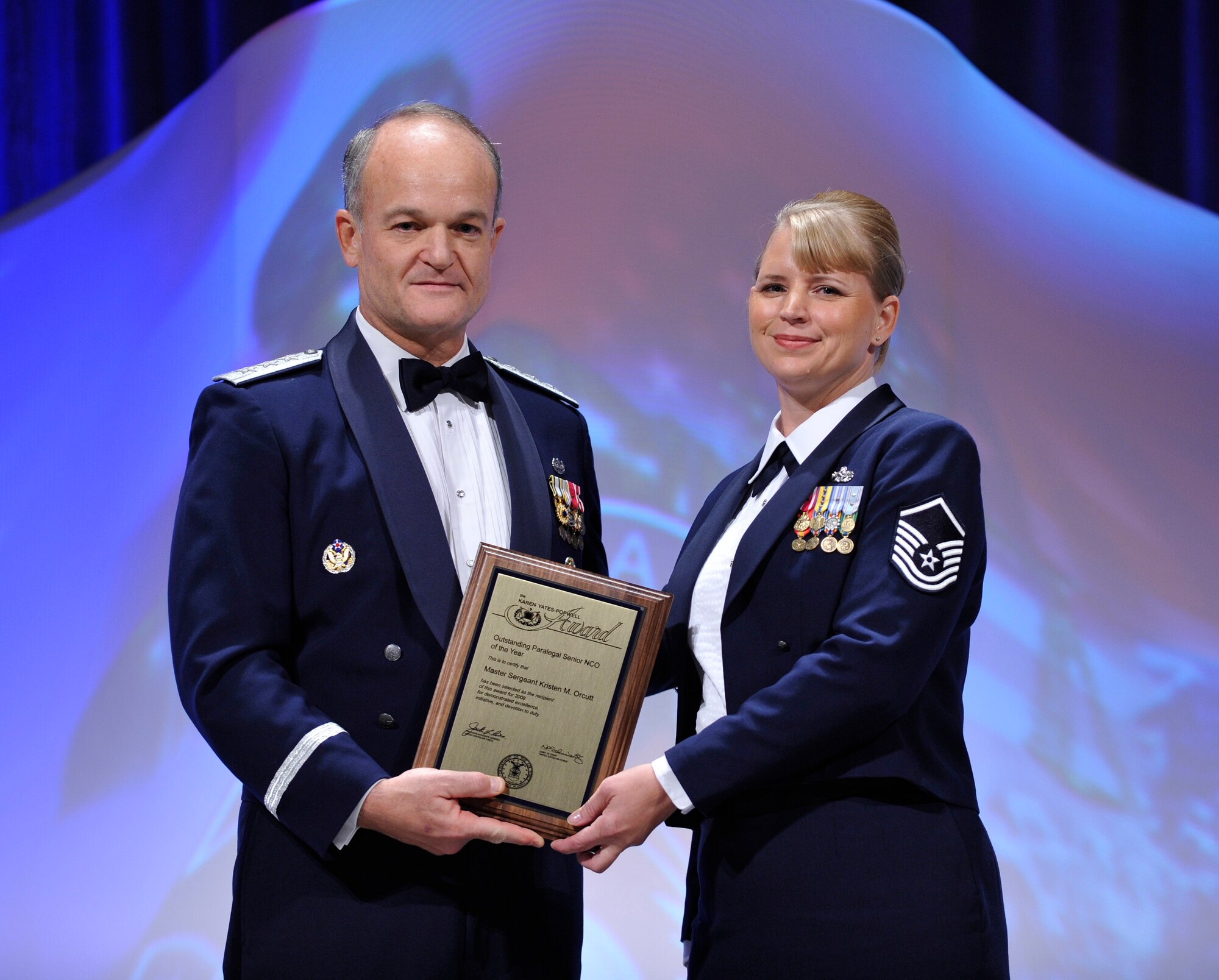 Lt. Gen Jack L. Rives, The U.S. Air Force Judge Advocate General (left), presents the Karen E. Yates-Popwell Award to Master Sergeant Kristin M. Orcutt, Air Force Special Operations Command (right), at The U.S. Air Force Judge Advocate General Corps' Keystone Conference 2009,  Dallas, Texas, October 29, 2009. (U.S. Air Force photo by Jim Varhegyi)
