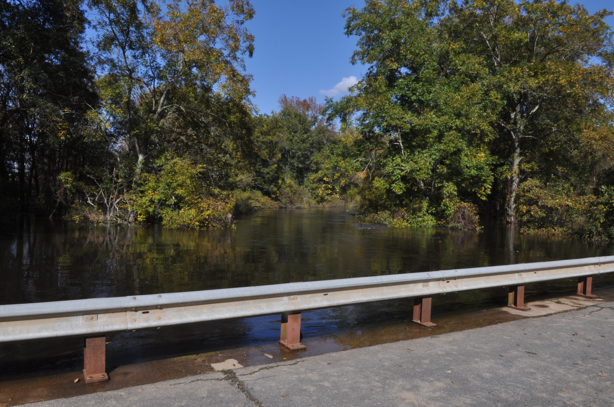 Water rises within inches of flowing over a bridge in a northern Bossier Parish neighborhood. Hundreds of Airmen from Barksdale Air Force Base La., joined together with Soldiers from the 527th Engineers of the Louisiana National Guard and other volunteers on Oct. 31 to sand bag a levee containing the Red Chute Bayou.  Sand bags were still being placed during the evening of November4. (U.S. Air Force photo/Tech. Sgt. Jeff Walston)
