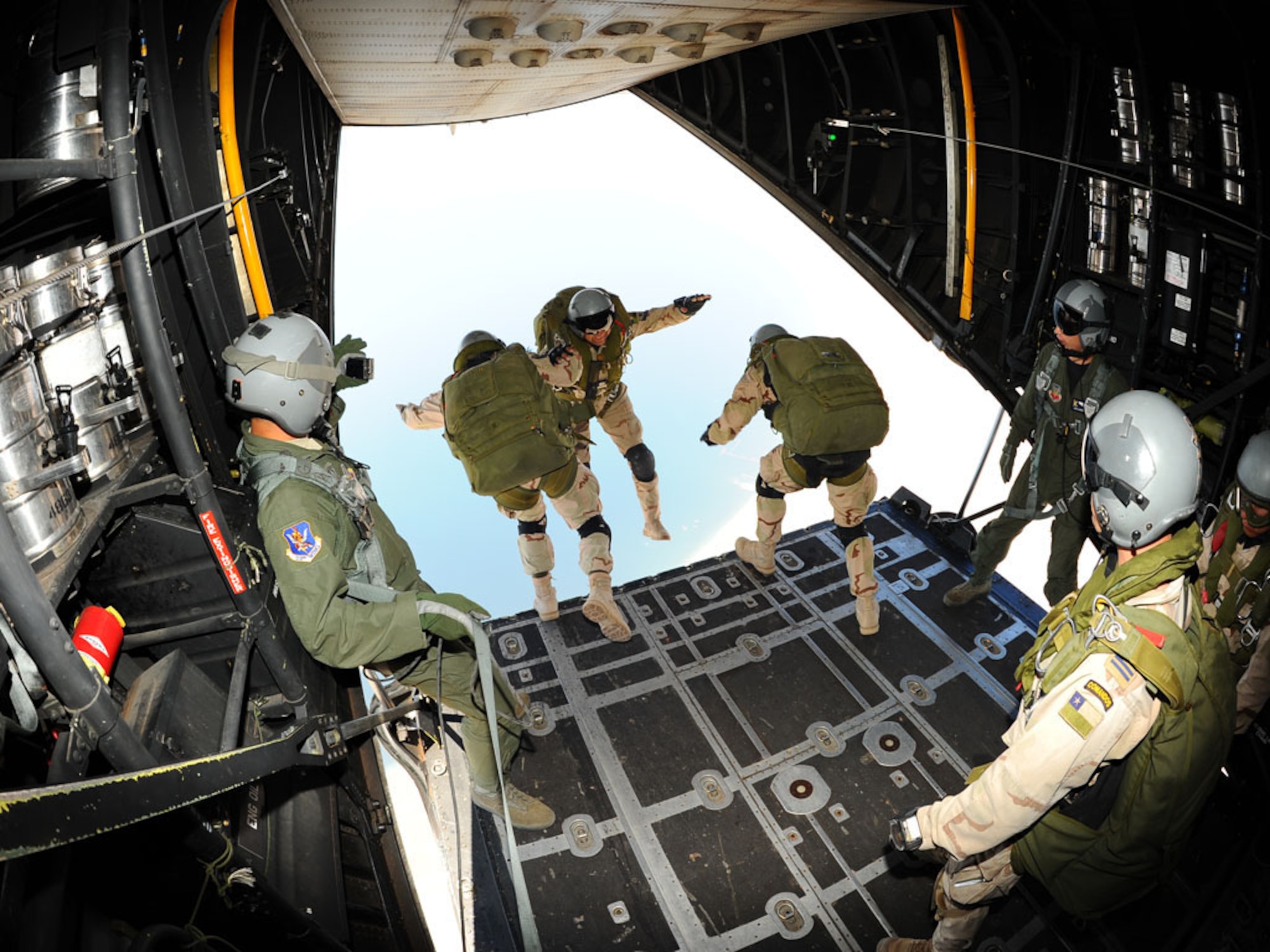 Pararescue jumpers from the Chilean air force leap from a U.S. Air Force HC-130 during Exercise Salitre Oct. 22, 2009, over Chile. The multinational exercise focused on interoperability between Chile, the United States, Argentina, Brazil and France. (U.S. Air Force photo/Master Sgt. Daniel Farrell) 
