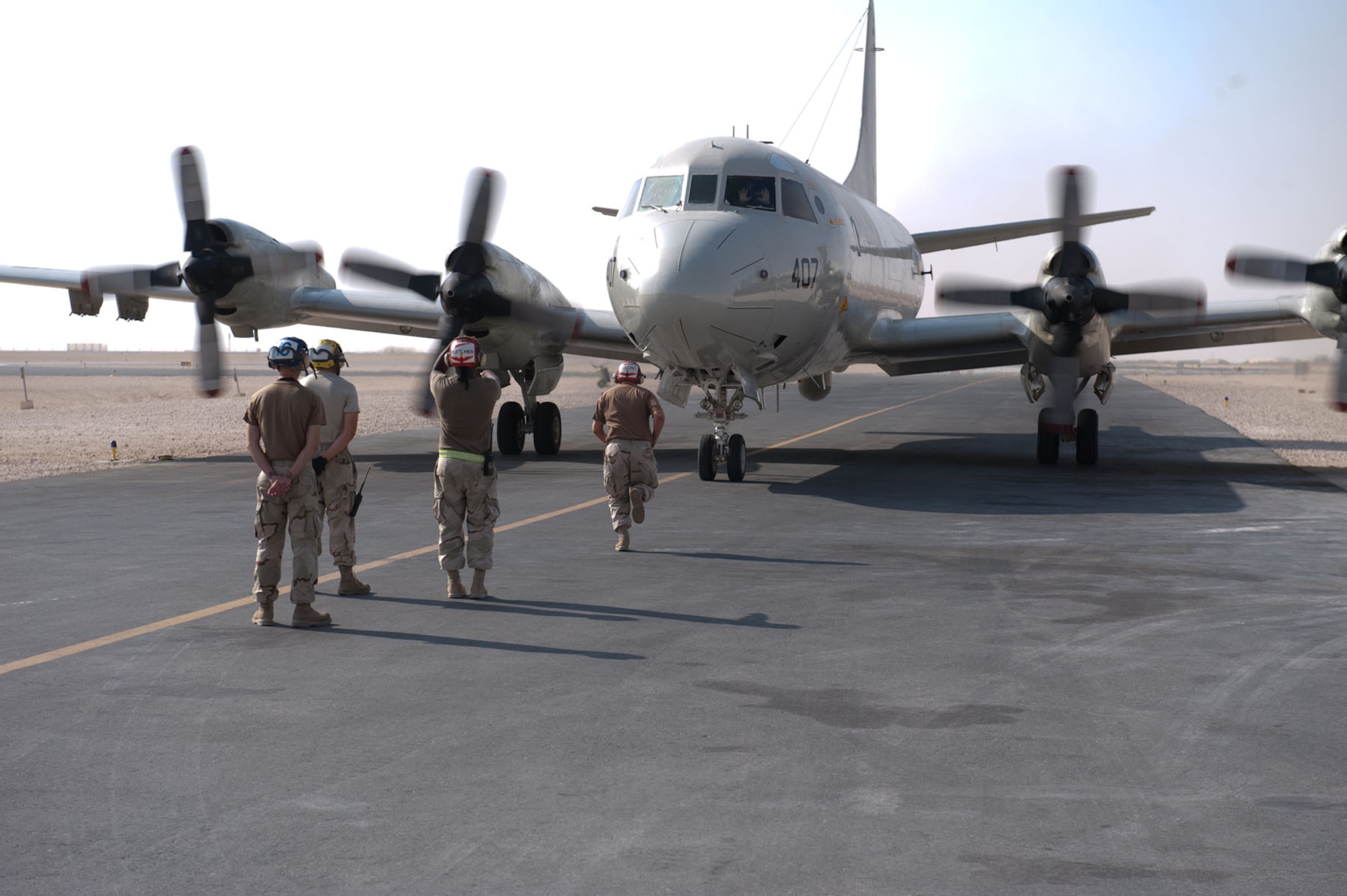 U.S. Navy Aviation Ordnanceman Airman Shawn Kelly, Patrol Squadron 10, runs toward a P-3 Orion during training in the de-arming of a Captive Air Training Armament 65 maverick missile, Nov. 4, 2009, in Southwest Asia. The VP-10 P-3s, deployed from Jacksonville Naval Station, Fla., are four-engine turboprop anti-submarine and maritime surveillance aircraft capable of carrying CATM-65s in support of operations Iraqi and Enduring Freedom. (U.S. Air Force photo/Staff Sgt. Robert Barney) 