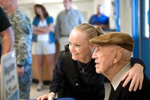 Army National Guard Sgt. Kisha Makerney smiles with retired Doolittle Raider Lt. Col, Dick Cole during a day dedicated to disabled veterans on Nov. 5, 2009, in San Antonio.  The Disabled American Veterans Flight Team coordinated a flight day for wounded warriors and their families to fly in historic military aircraft and experimental acrobatic planes at the San Antonio International Airport. Sergeant Makerney is a Fort Townsend, Okla., native currently assigned to the Warrior Transition Unit at the San Antonio Military Medical Center. Colonel Cole and aircrews came from across the region to participate in the Randolph Air Force Base Forging the Future Air Show on November 7-8. Colonel Cole was Col. Jimmy Doolittle's co-pilot for the World War II Doolittle raid on Tokyo. (U.S. Air Force photo/Lance Cheung)