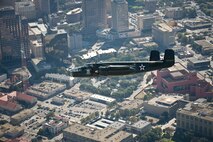 The B-25 Mitchell medium bomber "Special Delivery" took off from San Antonio International Airport, Texas and flew near the downtown district on Nov. 5, 2009. Tower of Americas, Texan Culture Center, and the Alamo are some of the notable sights below. Larry Gregory is one of the pilots of the B-25 of the Lone Star Flight Museum. Disabled American Veterans (DAV) Flight Team organized flights aboard approximately 10 historic or experimental air show aircraft for wounded warriors from the Warrior Transition Unit of the San Antonio Military Medical Center at Fort Sam Houston, Texas, two days before the Randolph Air Force Base "Forging the Future" Air Show.  DAV a non-profit organization provides services in support of disabled veterans. This is not an U.S. Air Force endorsement of DAV. (U.S. Air Force photo/Lance Cheung)
