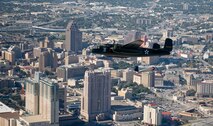 The B-25 Mitchell medium bomber "Special Delivery" and a Japanese A6M2 Zero replica built from a North American T-6 Texan fly over downtown San Antonio Nov. 5, 2009.  The Alamo is visible in the stand of trees to the left and below the Zero.  Larry Gregory is one of the pilots of the B-25 from the Lone Star Flight Museum and Jim Ryan pilots the Zero of Tora Tora Tora.  The Disabled American Veterans Flight Team organized flights aboard historic and experimental air show aircraft for wounded warriors from the Warrior Transition Unit of the San Antonio Military Medical Center at Fort Sam Houston, Texas, two days before the Randolph Air Force Base "Forging the Future" Air Show.  (U.S. Air Force photo/Lance Cheung)
