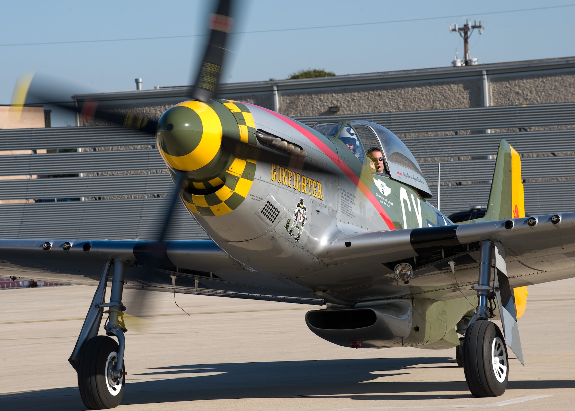 Jeff Linebaugh taxis out in the P-51 Mustang "Gunfighter" Nov. 5, 2009, with 1Lt. Ron Boisvert in the back.  The Disabled American Veterans Flight Team organized flights aboard historic and experimental air show aircraft for wounded warriors from the Warrior Transition Unit of the San Antonio Military Medical Center at Fort Sam Houston, Texas, two days before the Randolph Air Force Base "Forging the Future" Air Show.  (U.S. Air Force photo/Lance Cheung)