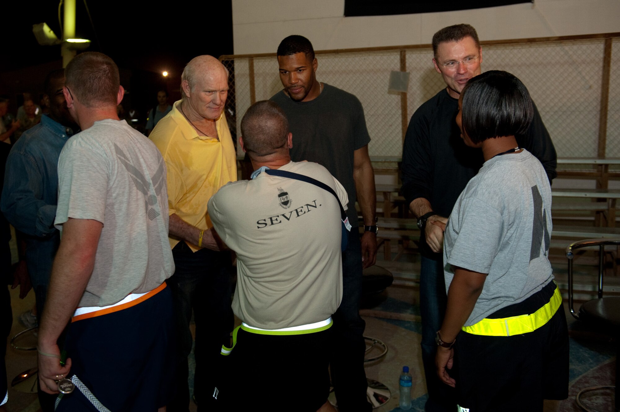 Left to Right, Terry Bradshaw, Michael Strahan and Howie Long,  NFL on FOX analysts and former NFL players, visit with deployed servicemembers in Southwest Asia, Nov. 4, 2009. The football analysts are touring the U.S. Central Command's area of responsibility as part of an Armed Forces Entertainment-sponsored tour. (US Air Force Photo/Staff Sgt. Robert Barney)