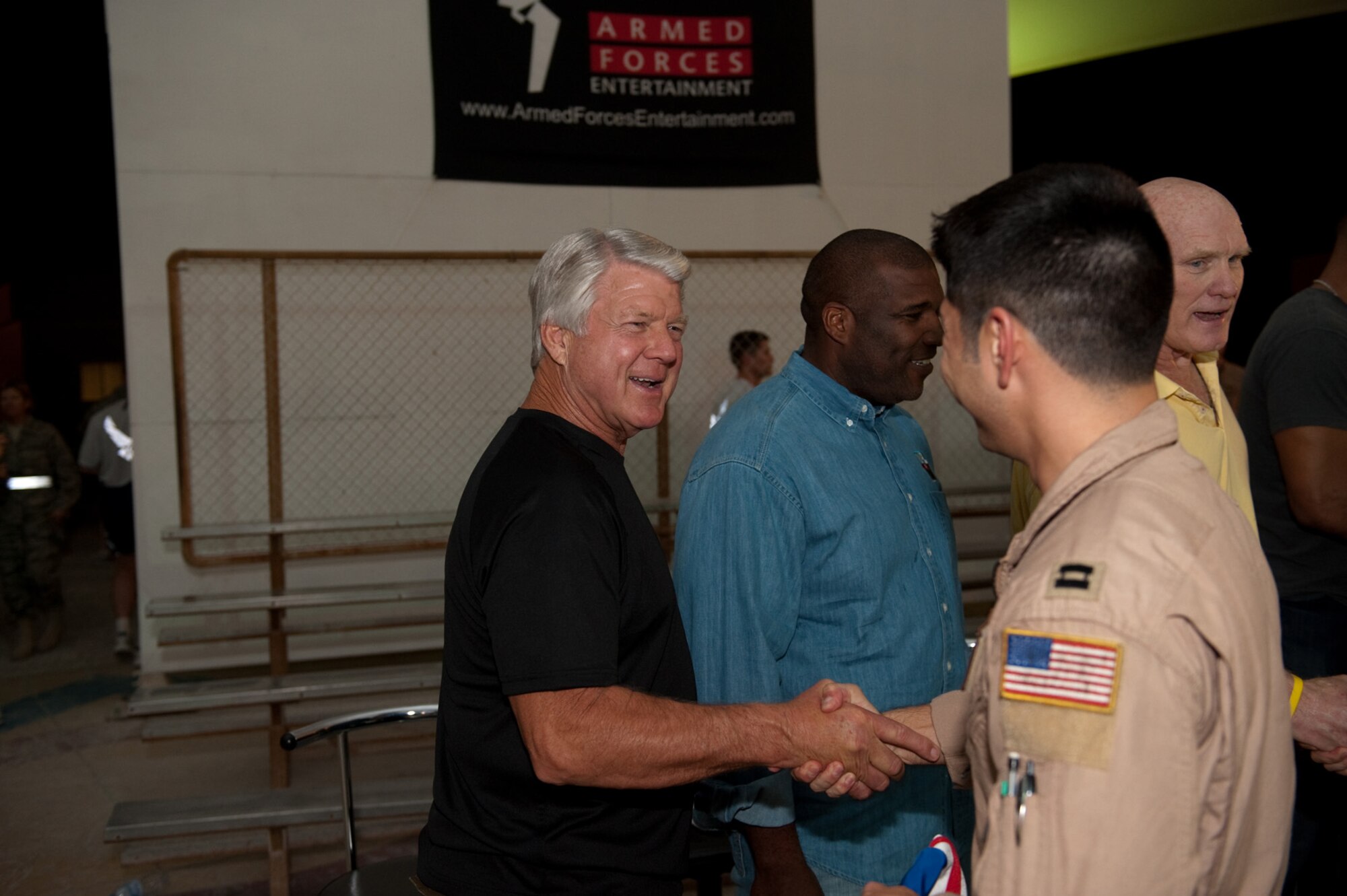 Jimmy Johnson, NFL on FOX analyst and former college and NFL coach, visits with deployed servicemembers in Southwest Asia, Nov. 4, 2009. Mr. Johnson is touring the U.S. Central Command's area of responsibility as part of an Armed Forces Entertainment-sponsored tour. (U.S. Air Force Photo/Staff Sgt. Robert Barney)
