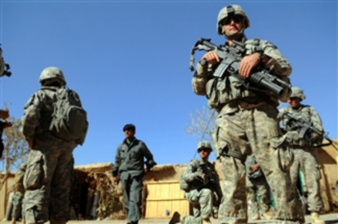 U.S. Army soldiers of Alpha Company, 4th Battalion, 23rd Infantry Regiment patrol the streets of Karezgay, Afghanistan, on Oct. 31, 2009.  The soldiers are deployed to Forward Operating Base Wolverine, Zabul, Afghanistan, to conduct counterinsurgency operations.  