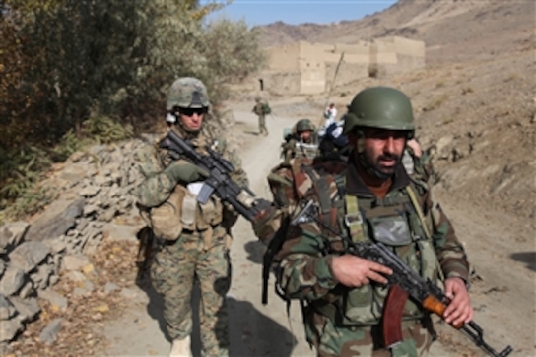 Afghan National Army soldiers, U.S. Marines from Embedded Training Team 1-12th and U.S. Army soldiers patrol the Depak Valley, Afghanistan, on Oct. 30, 2009.  