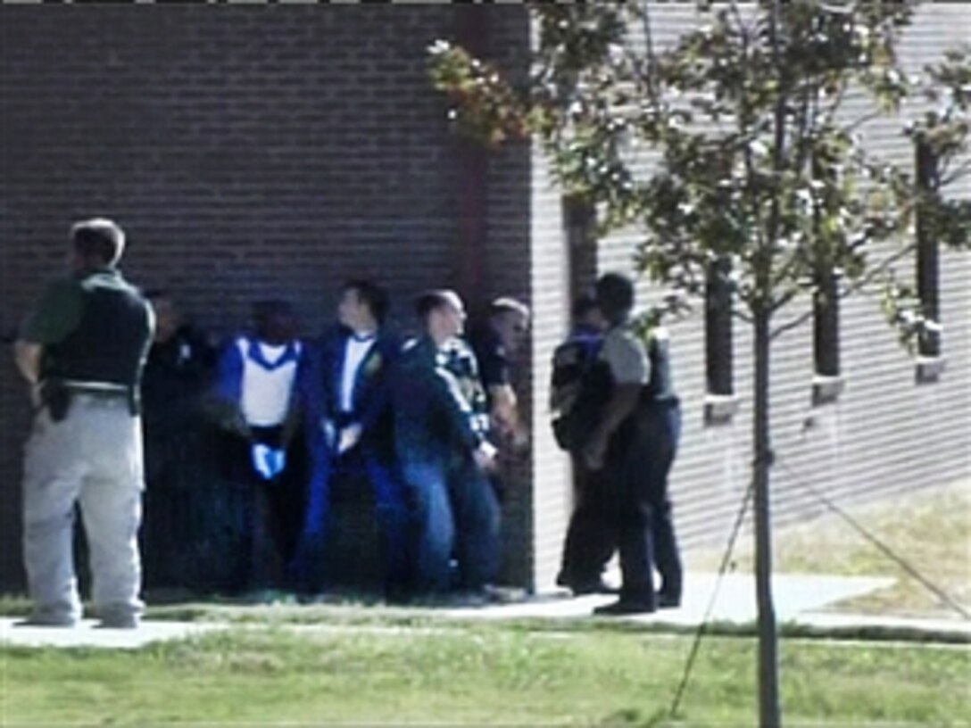 Members of the law enforcement community deploy on Fort Hood, Texas, during a shooting spree that killed 13 people and injured 30 others, Nov. 5, 2009.